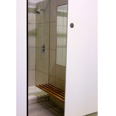 Enclosed commercial shower with drying and dressing space