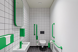 Bright green themed accessible washroom
